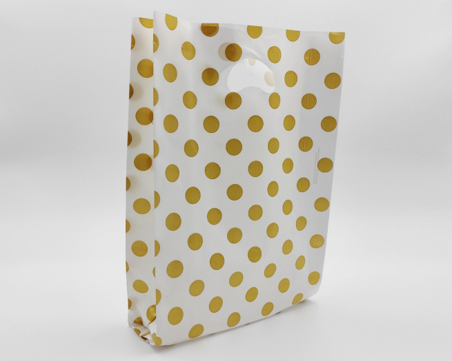 Shopper in plastica HDPE bianco con fantasia "Pois" oro, maniglia fustellata a fagiolo, confezione da 5 kg.